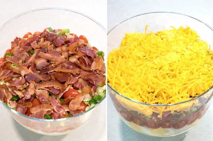 Classic Southern Seven-Layer Salad in a trifle dish showing the fifth layer of bacon and the sixth layer of shredded cheddar cheese.