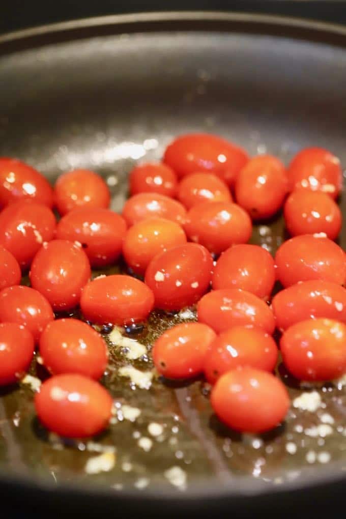 Cooking cherry tomatoes and garlic for Spaghetti with Fresh Cherry Tomatoes
