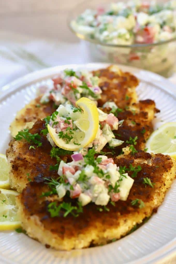 Three Parmesan Chicken Breast topped with creamy Cucumber Salsa