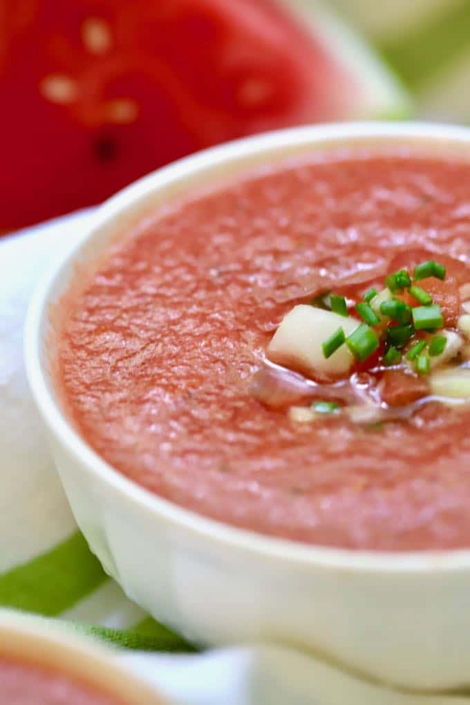 Close up of a large bowl of watermelon gazpacho soup
