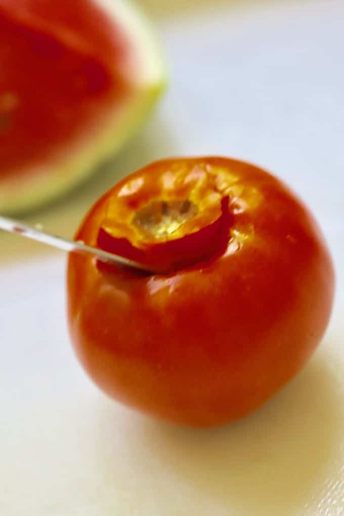 Coring a tomato for Chilled Watermelon Gazpacho Soup