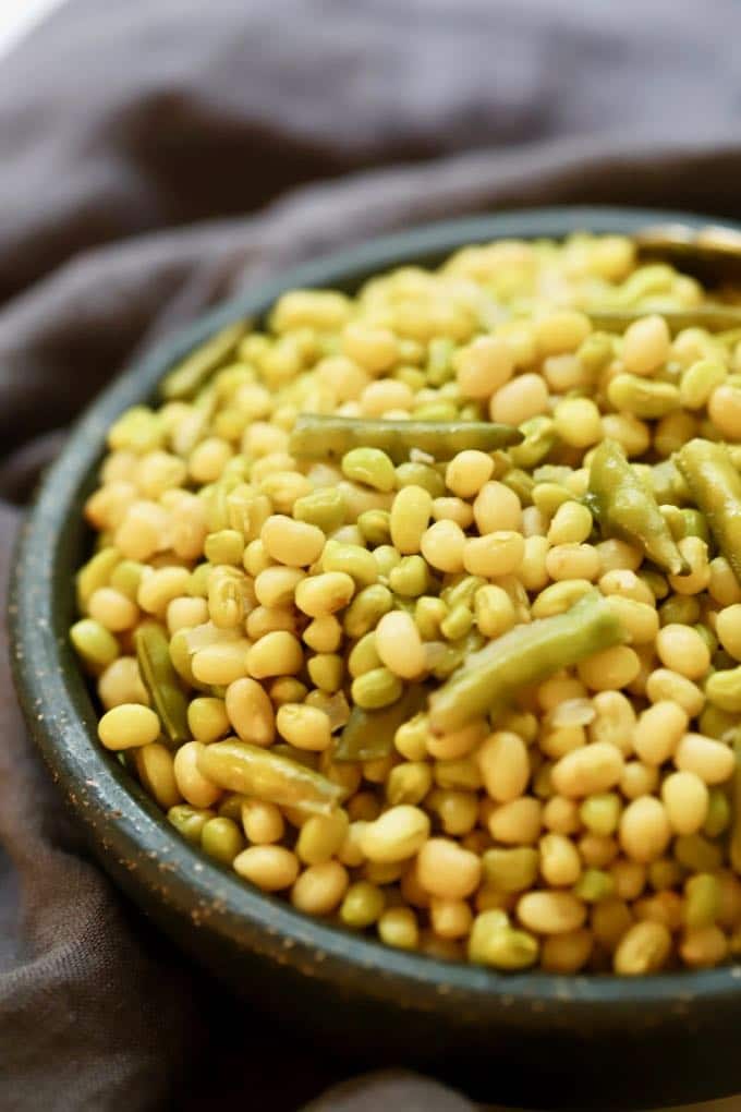 Close up shot of a large bowl of cooked cowpeas. 