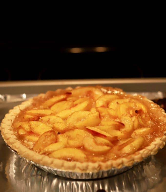 A peach pie cooling after baking.