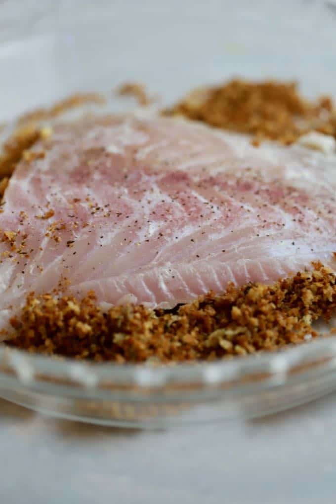 Dredging grouper fillets in a panko breadcrumb mixture. 