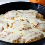 Orange Cinnamon Rolls covered with orange cream cheese glaze ready to serve