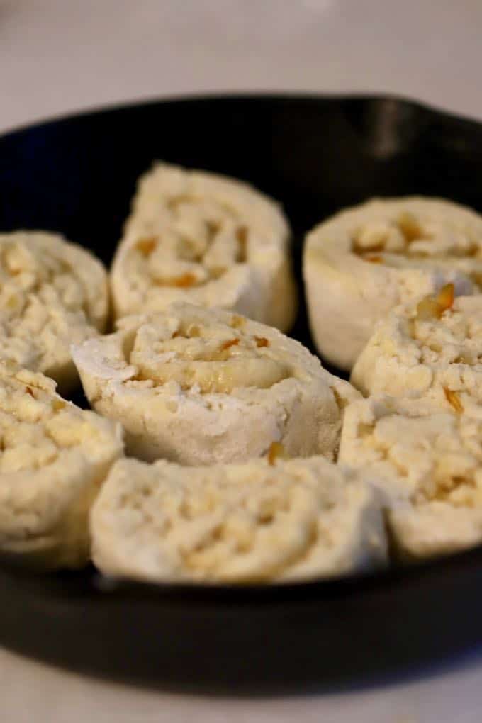 Orange Cinnamon Rolls in a cast iron pan ready to bake