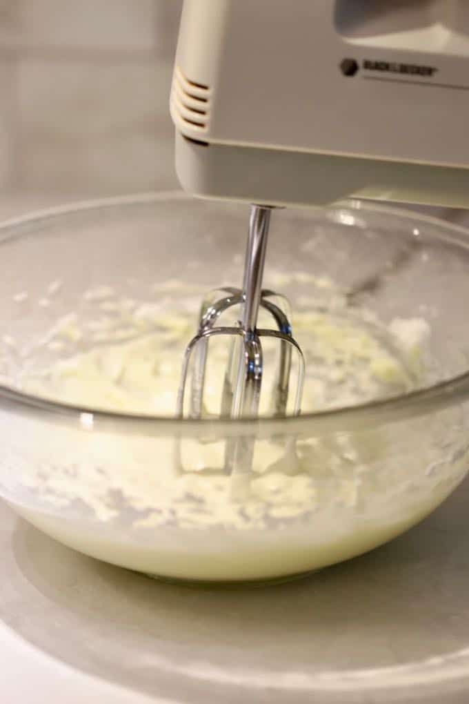 Mixing butter and cream cheese for Orange Cinnamon Rolls