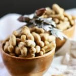 A wooden bowl filled with Easy Southern Boiled Peanuts