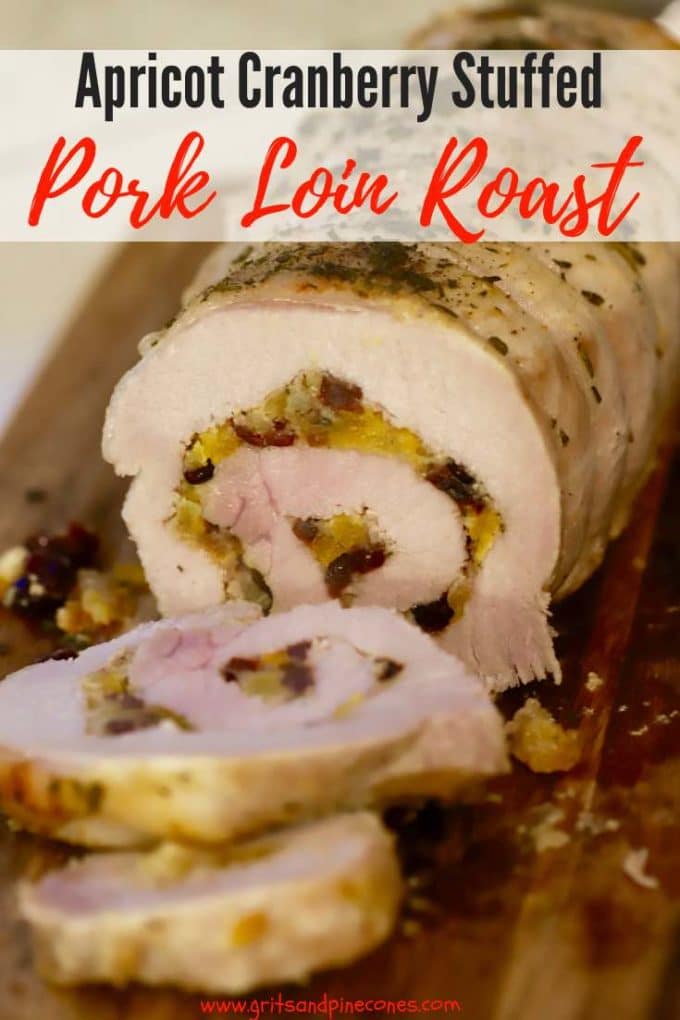 Apricot Cranberry Stuffed Pork Loin Roast is cooked in the oven and the stuffing includes luscious apricots and tart cranberries, cornbread, applesauce, garlic, shallots, celery, sage, thyme, and rosemary. This recipe also includes a delicious Apricot Wine Sauce and this dinner entree is perfect for your holiday entertaining or dinner parties. #gritsandpinecones, #dinner, #pork, #porkrecipes, #dinnerparty, #thanksgiving, #christmas