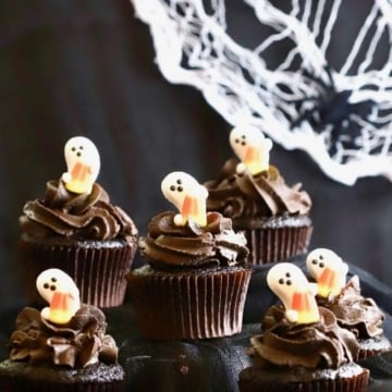Easy Chocolate Halloween Cupcakes and Icing with a spider web in the background