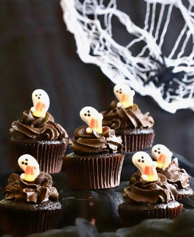 Easy Chocolate Halloween Cupcakes and Icing with a spider web in the background