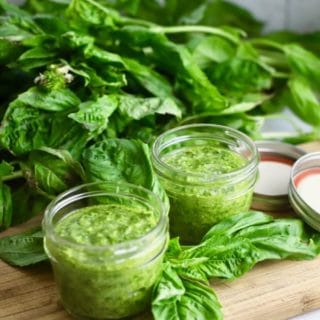 Easy Homemade Southern Basil Pesto in two glass jars