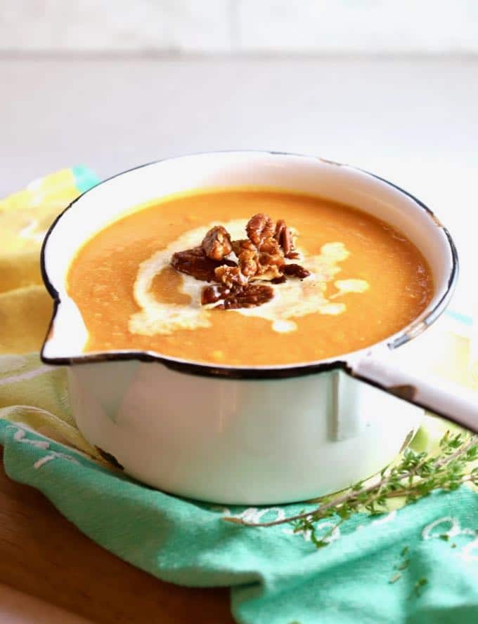 Easy Creamy Southern Sweet Potato Soup garnished with candied pecans