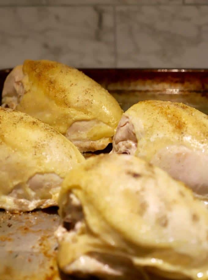 Easy Roasted Bone-In Chicken Breast right out of the oven on a baking sheet