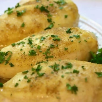 Three Easy Roasted Bone-In Chicken Breasts on a white plate