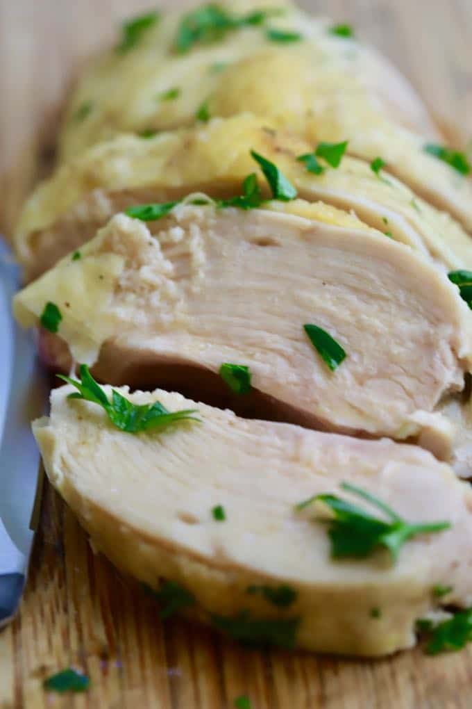 Easy Roasted Bone-In Chicken Breast sliced and ready to serve for dinner