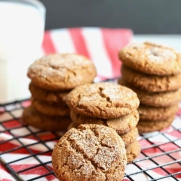 Stacks of Old Fashioned Crunchy Gingersnap Cookies on a cooling rack