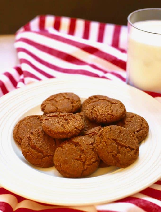 Old Fashioned Crunchy Gingersnap Cookies on a plate with a glass of milk