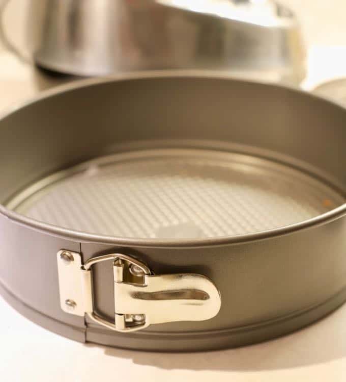 A springform pan used to make Apple Pie Cheesecake with Caramel Sauce