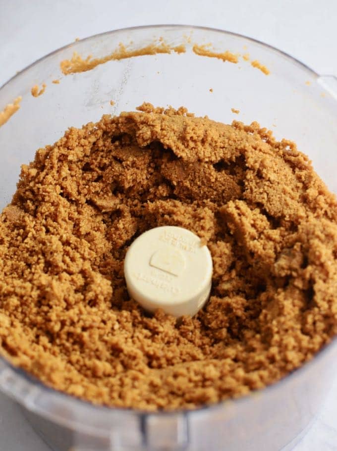 Gingersnap cookie crumbs to make the crust for Apple Pie Cheesecake with Caramel Sauce