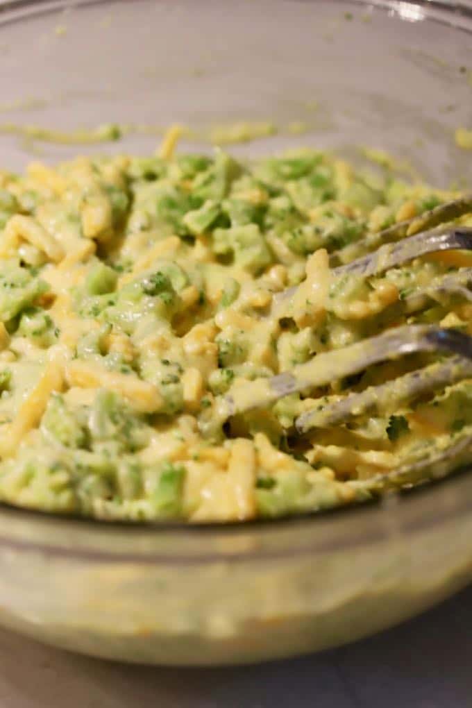 Batter in a bowl for Broccoli Cheddar Cheese Cornbread Muffins.