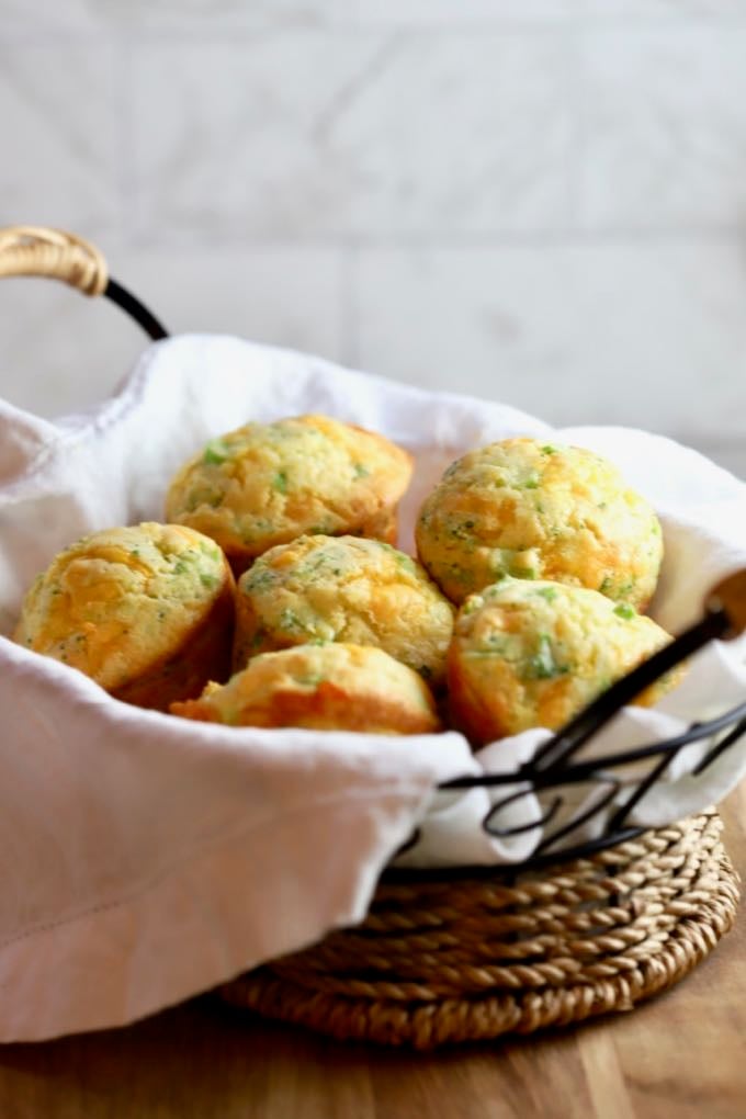 Broccoli Cheddar Cornbread Mini Muffins in a small basket.