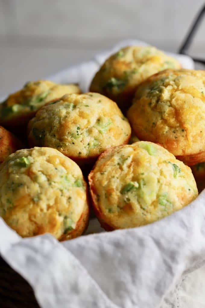 Broccoli Cheddar Cornbread Muffins in a basket and ready to serve.