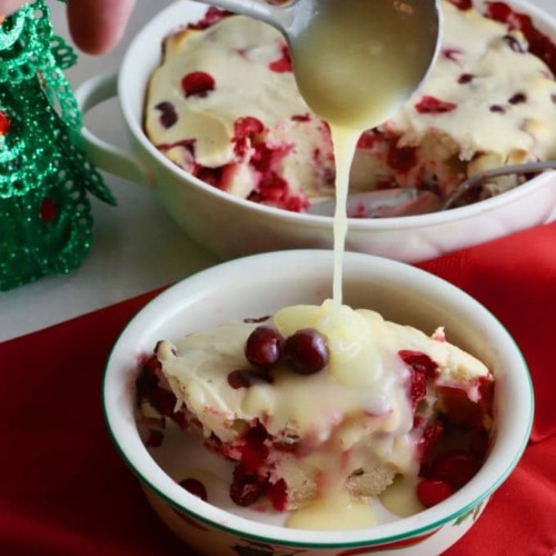 Cranberry Cake with Hard sauce in a Christmas bowl.