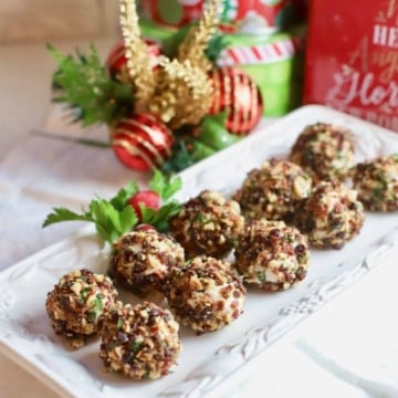 Cranberry Pecan Mini Goat Cheese Balls on a white plate.