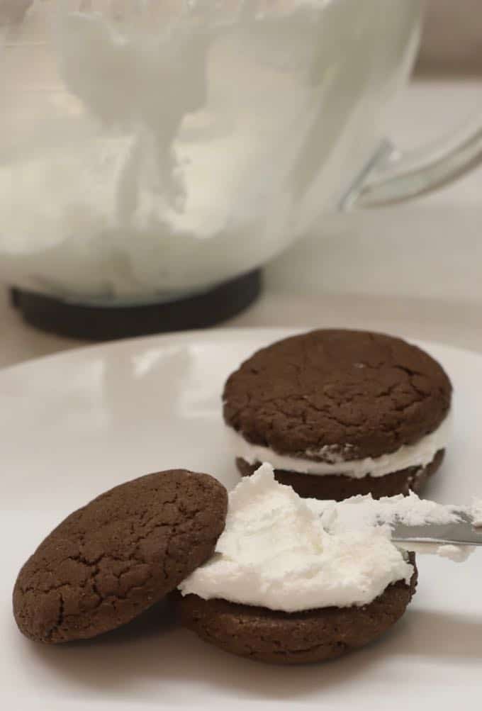 Placing the filling on one cookie for Easy Chocolate Peppermint Whoopie Pies