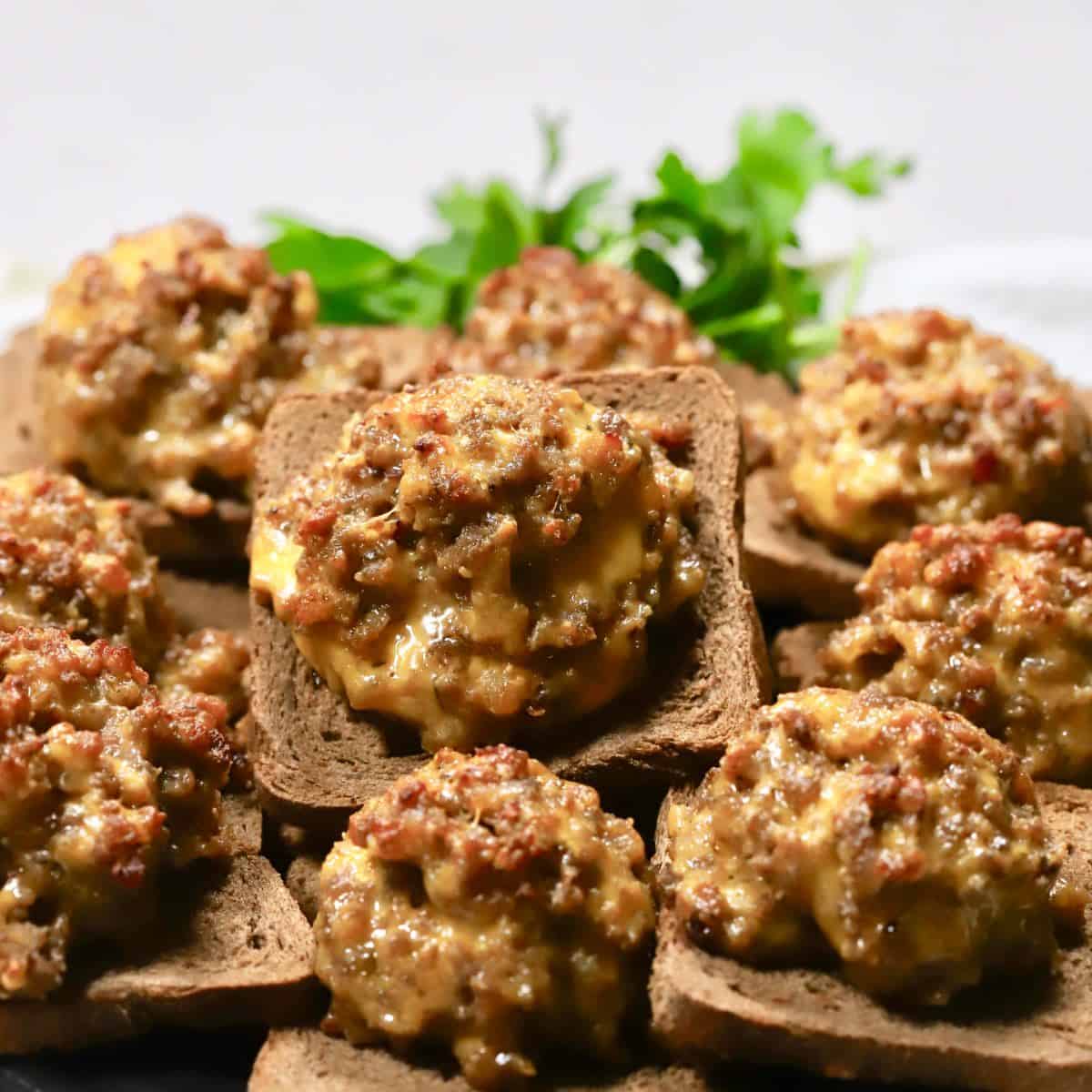 Hanky Panky appetizers on a plate garnished with parsley.