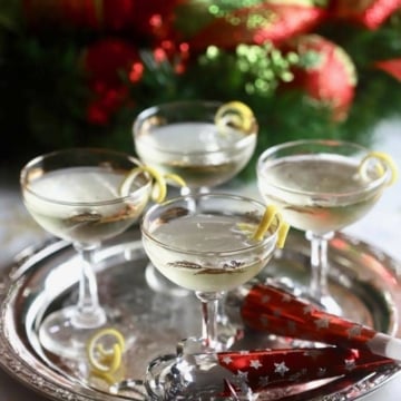 Four Meyer Lemon French 75 Cocktails on a silver tray.