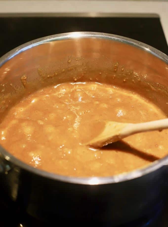 Candy mixture boiling in a pan to make homemade copycat kit kat bars. 