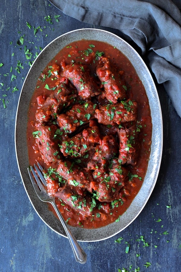Beef Braciole in a serving dish. Part of a roundup of 23 Easy Dinner Party Recipes. 