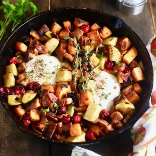 Easy Southern Sweet Potato Hash with eggs in a cast iron skillet.