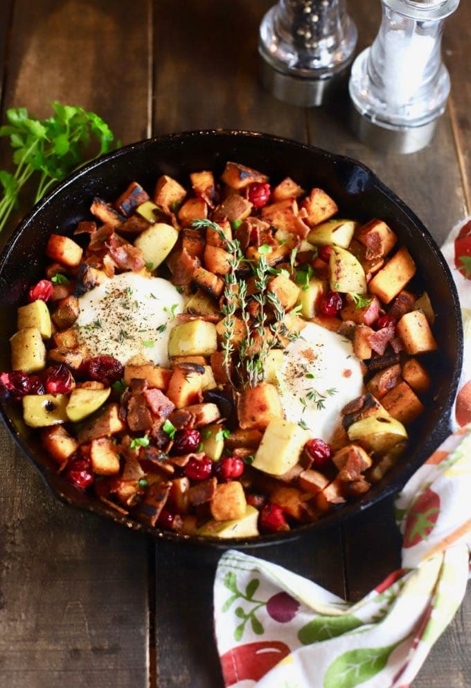 Easy Southern Sweet Potato Hash with eggs in a cast iron skillet.