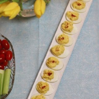 Classic Southern Deviled Eggs on a long narrow deviled egg serving dish.