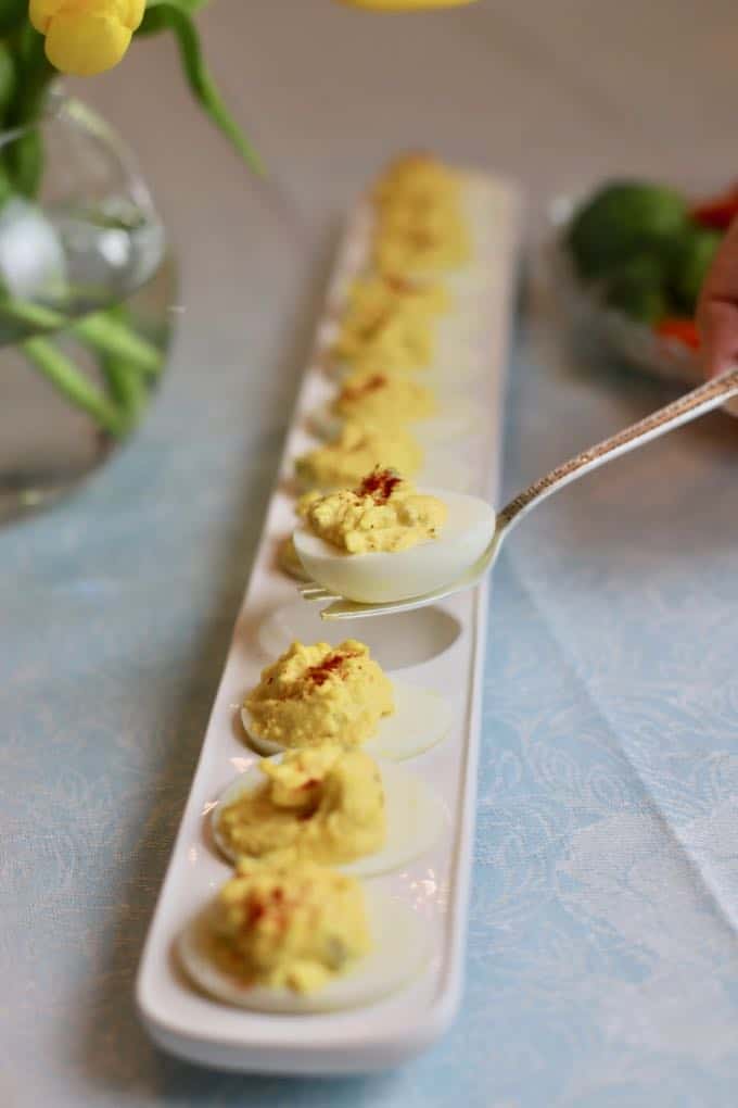 A Classic Southern Deviled Eggs on a serving fork.