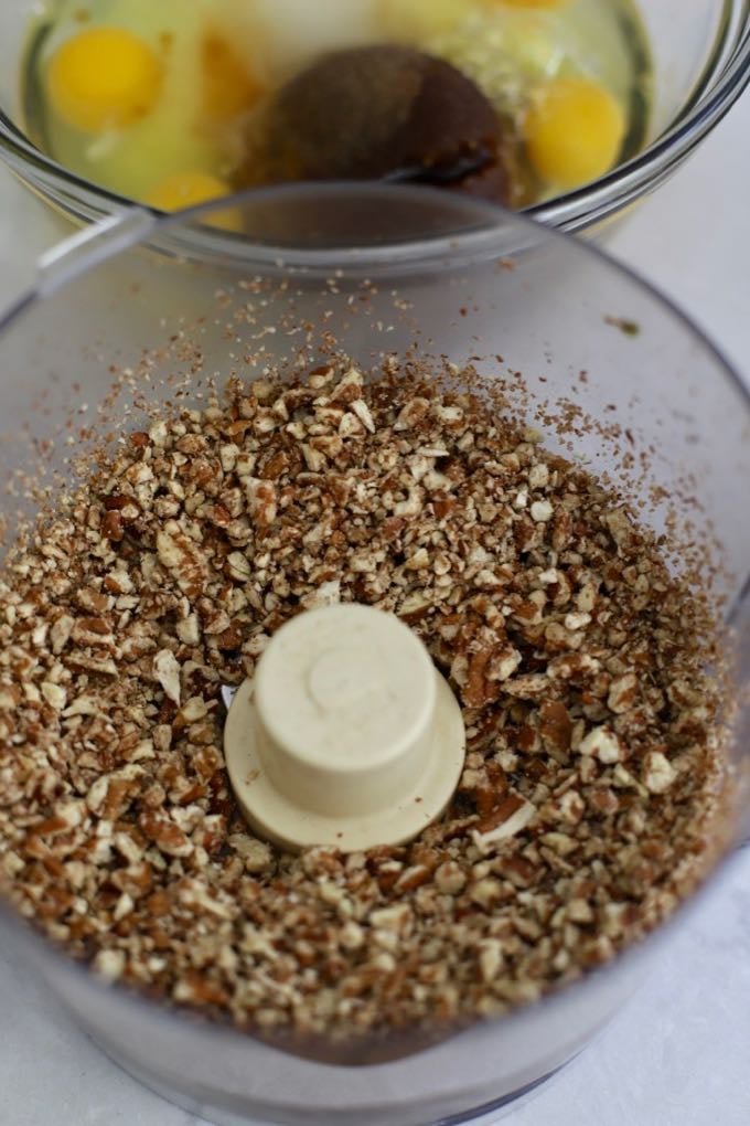 Chopping pecans in a food processor.