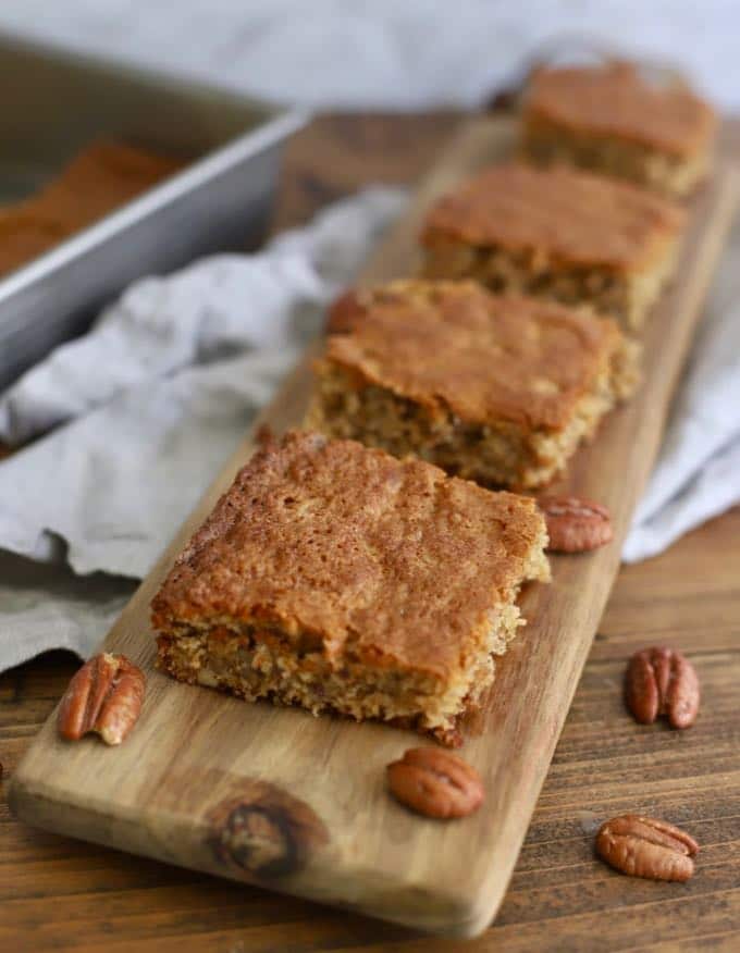 Squares of Georgia Cornbread Cake on a cutting board.