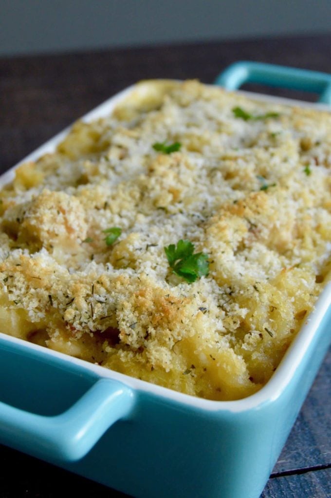 Cheesy Artichoke Chicken Casserole in a blue baking dish.