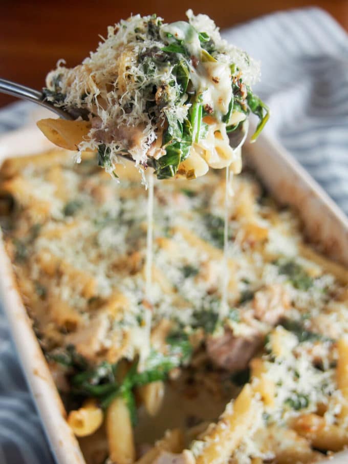 A large spoonful of creamy lemon chicken pasta bake.