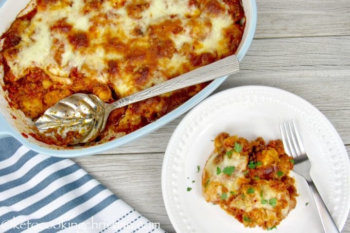 Chicken Parmesan Casserole and a white plate with a serving of it.