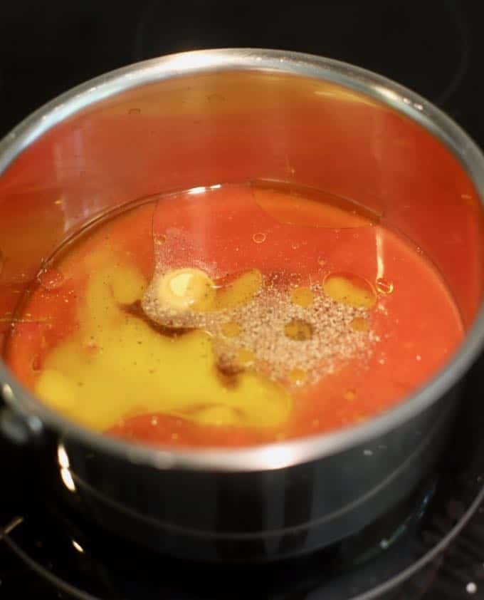 Copper Pennies marinade in a saucepan. 