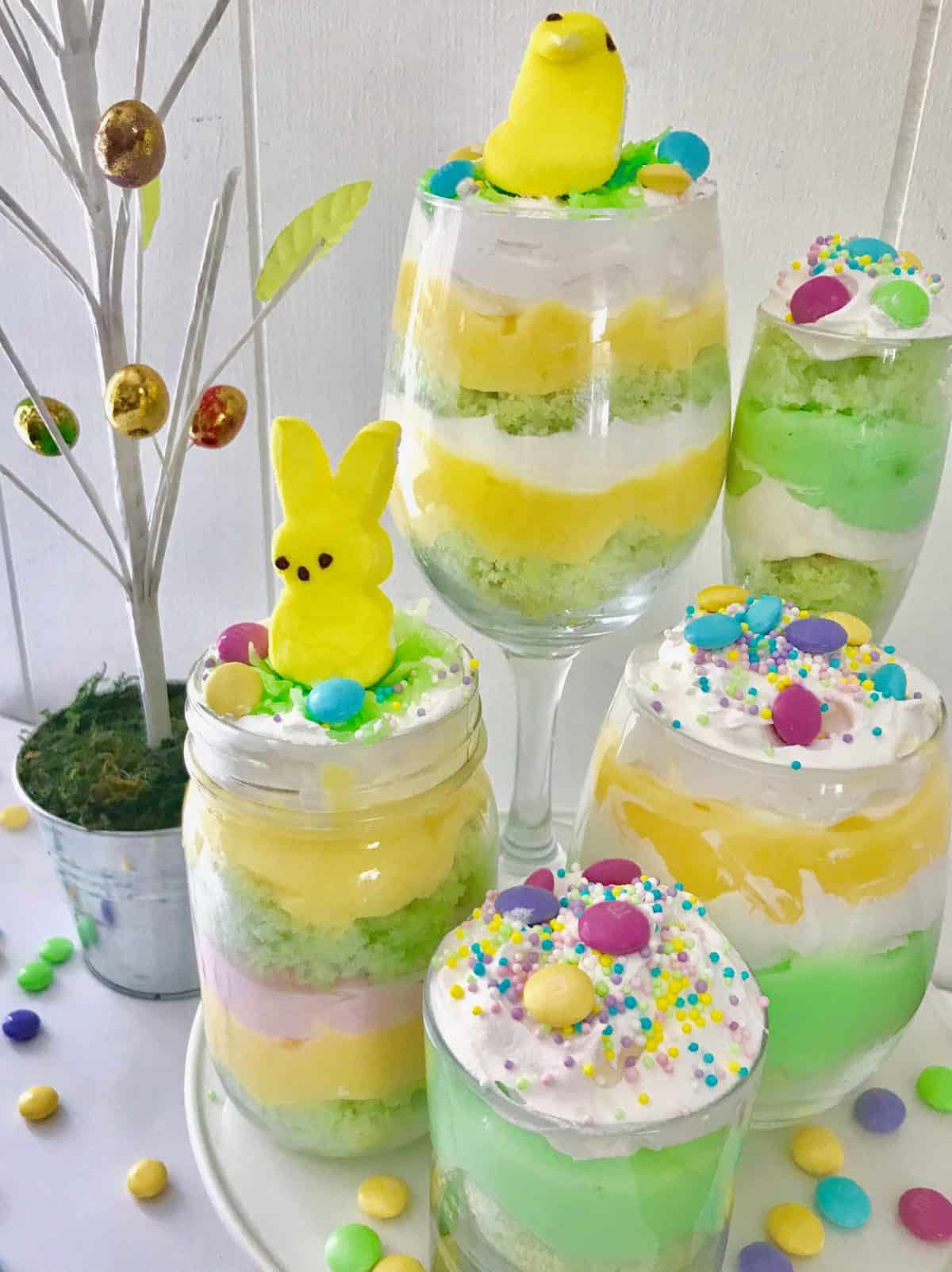 Five multicolor trifles topped with candy. aster 