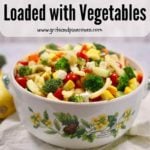 Pinterest pin with an image of a large serving bowl full of pasta salad with assorted vegetables.