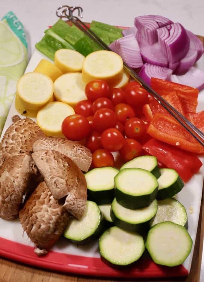 Fresh vegetables cup up and ready to place on skewers for grilled vegetable kabobs. 