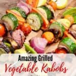 Pinterest pin, grilled vegetable kabobs on a wooden cutting board.