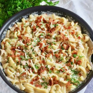 Chicken and bacon pasta in a skillet ready to eat.