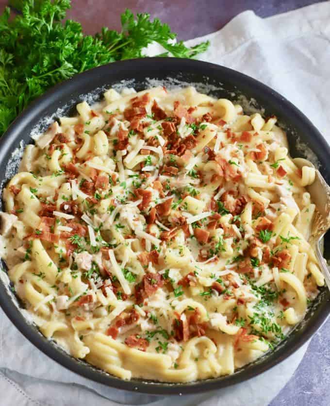 Chicken and bacon pasta in a skillet ready to eat. 